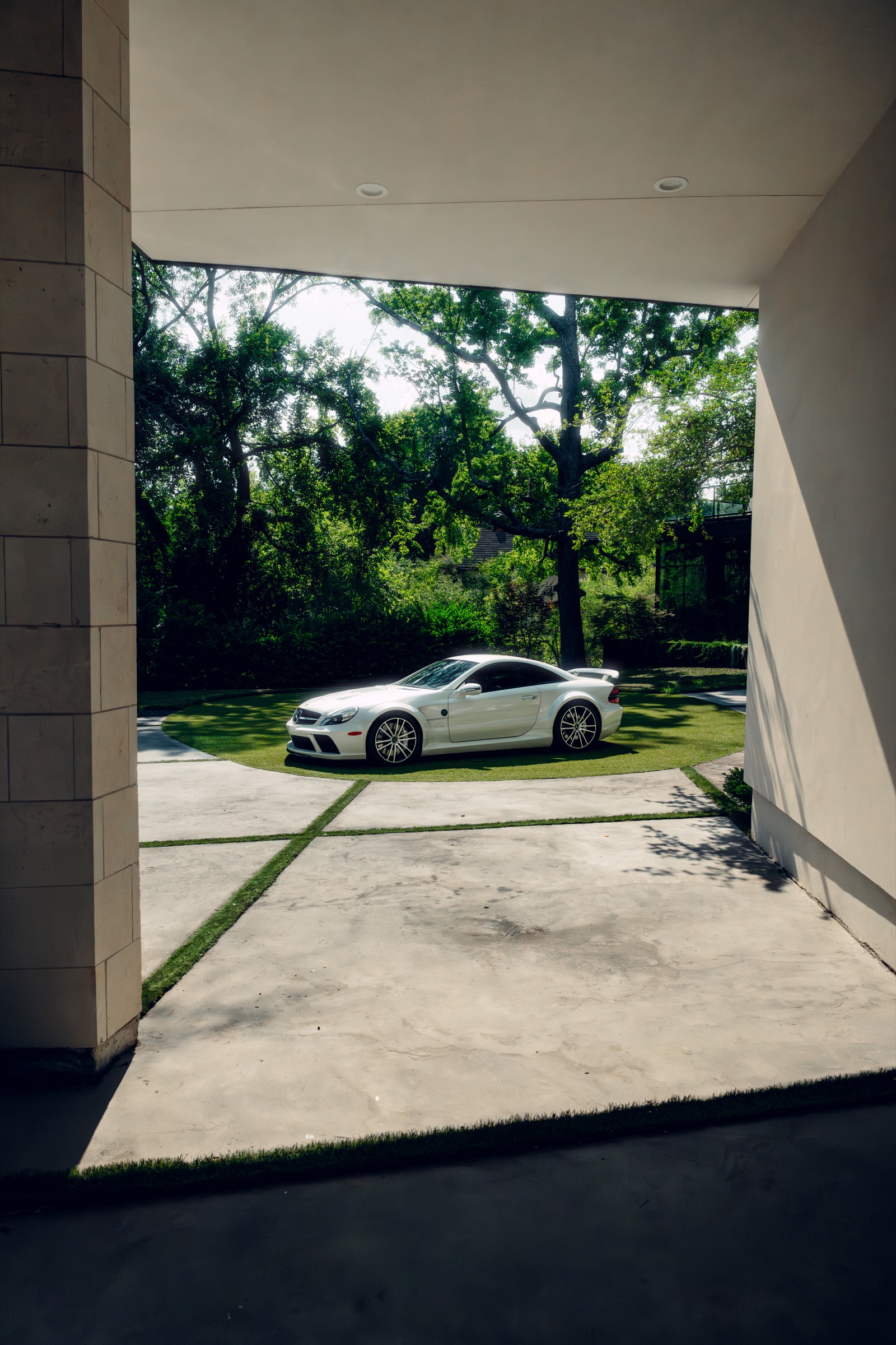 Mercedes SL65 AMG Black Series framed through estate columns